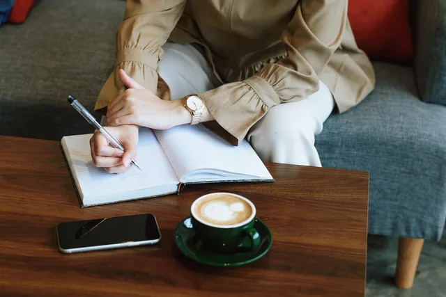 woman, writing, table, coffee, meeting, business, working, desk, notebook, meeting, meeting, meeting, meeting, meeting, business. How to shortlist branding agencies without a ranking score